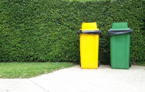 Workers sorting construction waste for recycling in Alperton